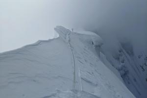 Rick navigating double cornices along the summit ridge
